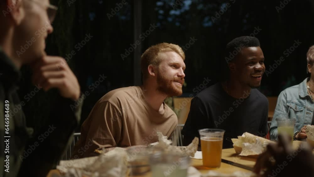 Friends Party In Summer Evening In Open Terrace Of Restaurant Or Backyard, Multiethnic People Friends Party In Summer Evening In Open Terrace Of Restaurant Or Backyard, Multiethnic People