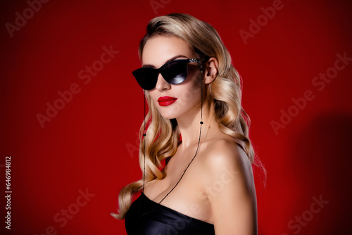 Photo of cool chic lady wear black sunglass have fun on vip party spying personal information over red color background