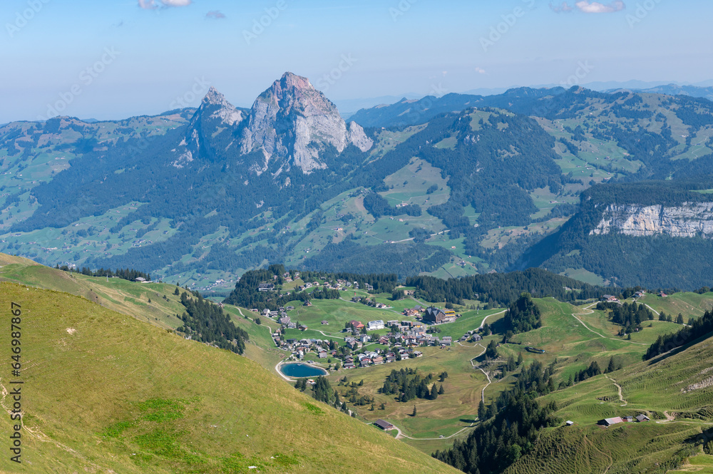 Alpine panoramic view from Fronalpstock in the Swiss mountains, overlooking the peaks of the grosser und kleiner Mythen on a sunny autumn day Alpine panoramic view from Fronalpstock in the Swiss mountains, overlooking the peaks of the grosser und kleiner Mythen on a sunny autumn day