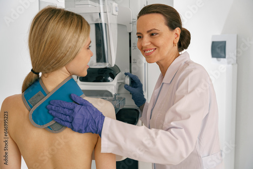Fototapeta Naklejka Na Ścianę i Meble -  Woman doing mammogram x ray for breast cancer prevention screening at hospital