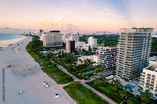 Miami Beach  Florida  USA - Morning aerial view of luxury condominiums and hotels with the Miami skyline in the distance.