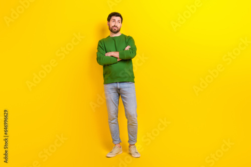 Full body cadre of pensive young businessman wear jumper denim jeans folded hands manager look novelty isolated on yellow color background