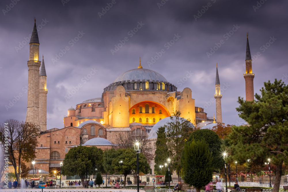 Dramatic cloudy sky at twilight over Hagia Sophia mosque and Sultanahmet Square, Istanbul, Turkey