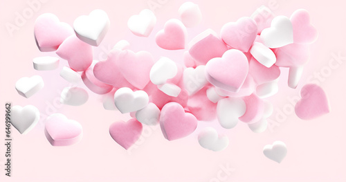 White and pink heart marshmallows falling. Blurred marshmallow candy background.