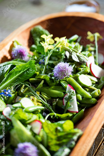 Spring Salad with radishes, flowers, and snap peas 