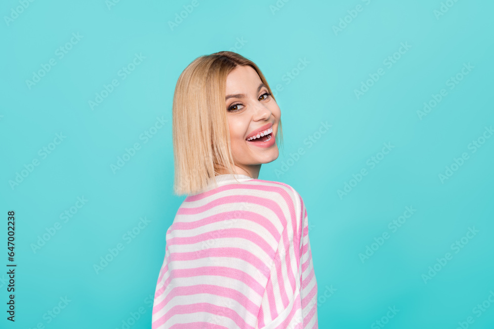 Closeup portrait of modest attractive young woman blonde bob hair wearing striped pink shirt isolated on aquamarine color background Closeup portrait of modest attractive young woman blonde bob hair wearing striped pink shirt isolated on aquamarine color background