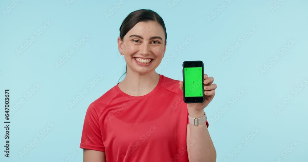 Green screen, hand pointing and woman face with phone in studio for fitness, app or sign up blue background. Smartphone, space and portrait of lady personal trainer show application, menu or process Green screen, hand pointing and woman face with phone in studio for fitness, app or sign up blue background. Smartphone, space and portrait of lady personal trainer show application, menu or process