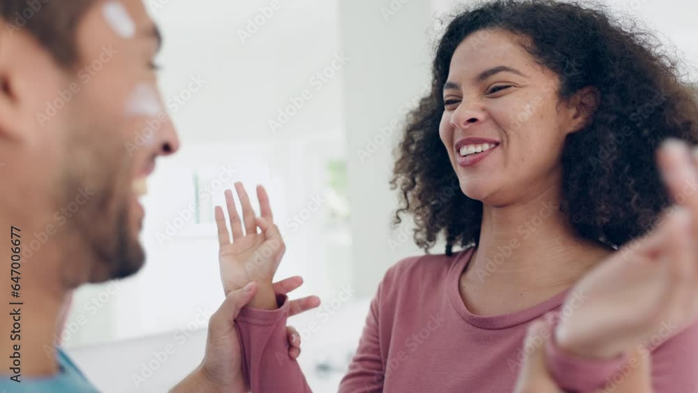 Couple laughing, bathroom and cream for morning routine with skincare and cosmetics treatment at home. House, cream and people together with wellness, face and mirror with care and facial support Couple laughing, bathroom and cream for morning routine with skincare and cosmetics treatment at home. House, cream and people together with wellness, face and mirror with care and facial support