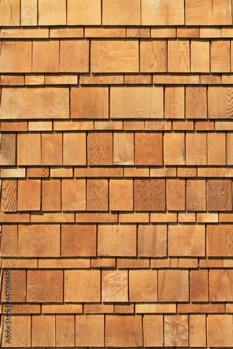Wooden cedar shake siding vertical exterior architecture background pattern