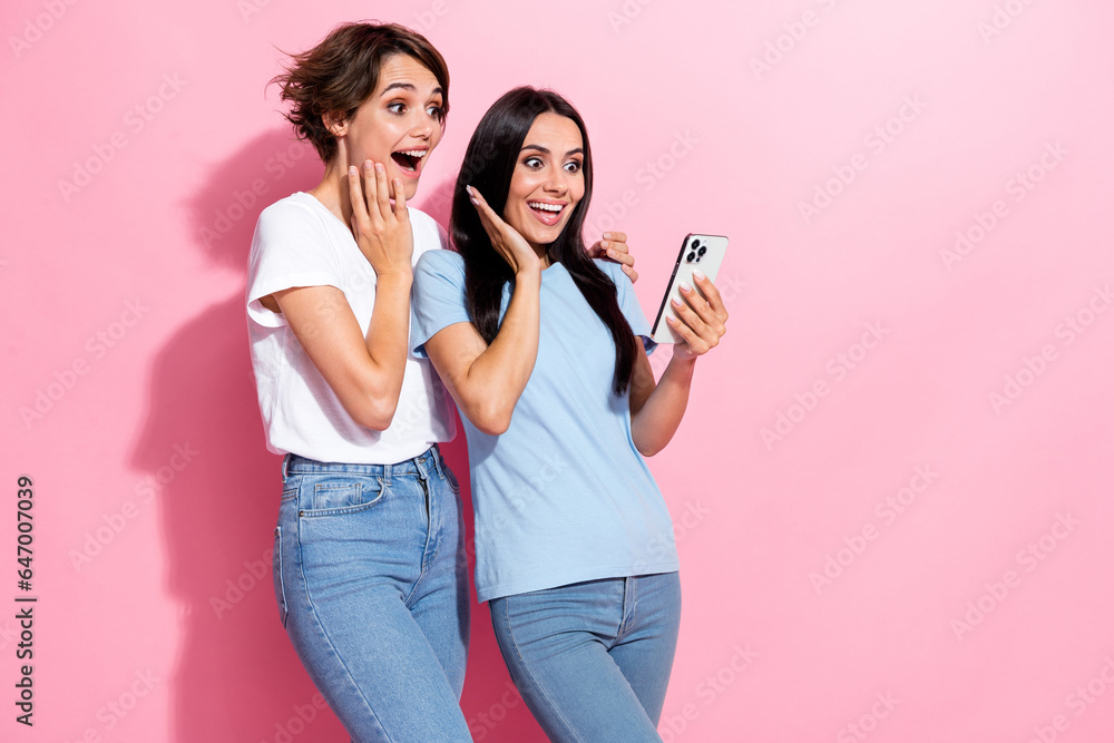 Photo of two best friends young women hands cheeks watching phone ...