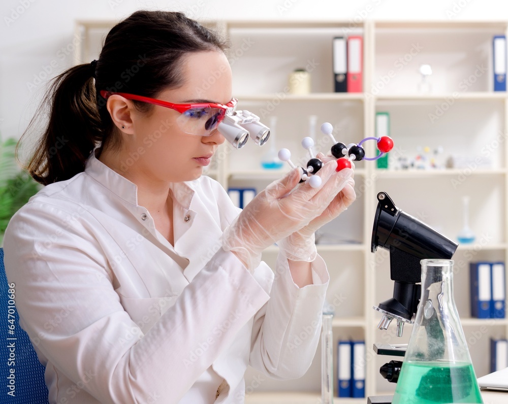 Young female chemist working in the lab Young female chemist working in the lab