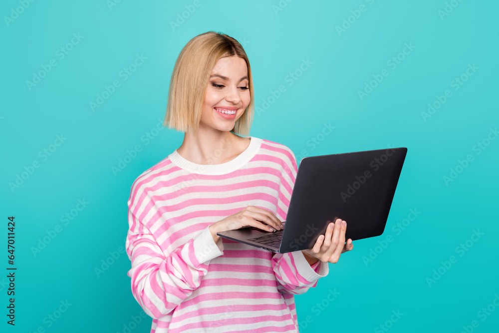 Photo of pretty sweet girl dressed striped sweater texting messages instagram twitter telegram facebook isolated teal color background Photo of pretty sweet girl dressed striped sweater texting messages instagram twitter telegram facebook isolated teal color background