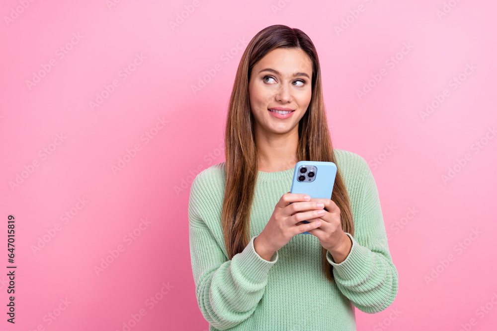 Photo of dreams charming lady young blogging holding blue case apple iphone looking interesting website isolated on pink color background Photo of dreams charming lady young blogging holding blue case apple iphone looking interesting website isolated on pink color background