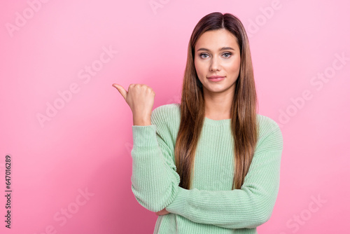 Photo of confident marketing producer young girl brown hair trendy green pullover indicate finger novelty isolated on pink color background