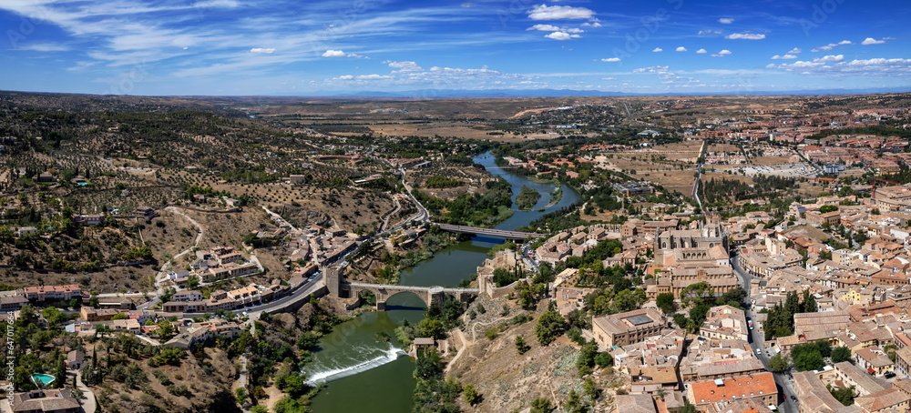 Aerial panoramic view of the Tagus River and Toledo, Spain on a sunny day