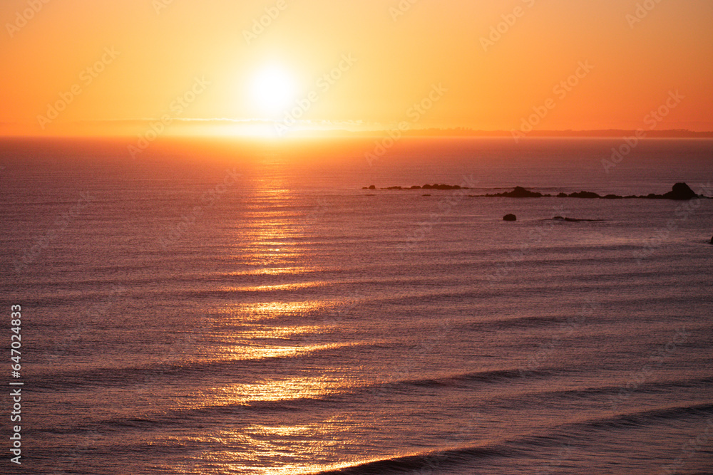 sunrise shining over the ocean