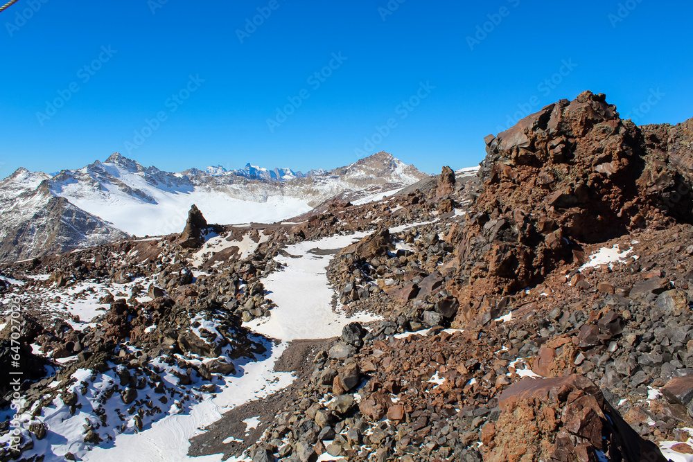 Beautiful mountain landscape with snowy and peaks, volcanic rocks