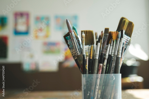 Close up of painting brushes in studio of artist..
