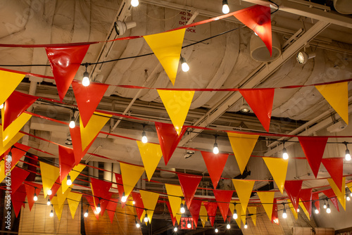 red and yellow flags in little spain restaurant photo
