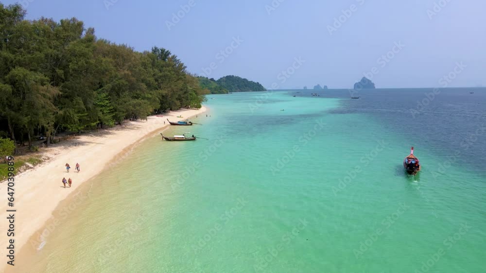 Koh Kradan Island Trang in Thailand, aerial drone view over the tropical beach with blue ocean of Koh Kradan Island Trang from above. beach with turqouse colored ocean Koh Kradan Island Trang in Thailand, aerial drone view over the tropical beach with blue ocean of Koh Kradan Island Trang from above. beach with turqouse colored ocean