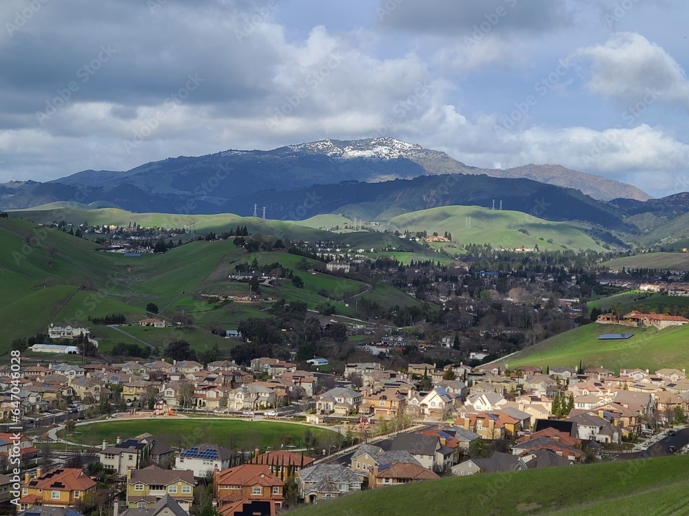Homes in San Ramon between rolling hills of East Bay and snowy Mt Diablo after a winter storm Homes in San Ramon between rolling hills of East Bay and snowy Mt Diablo after a winter storm