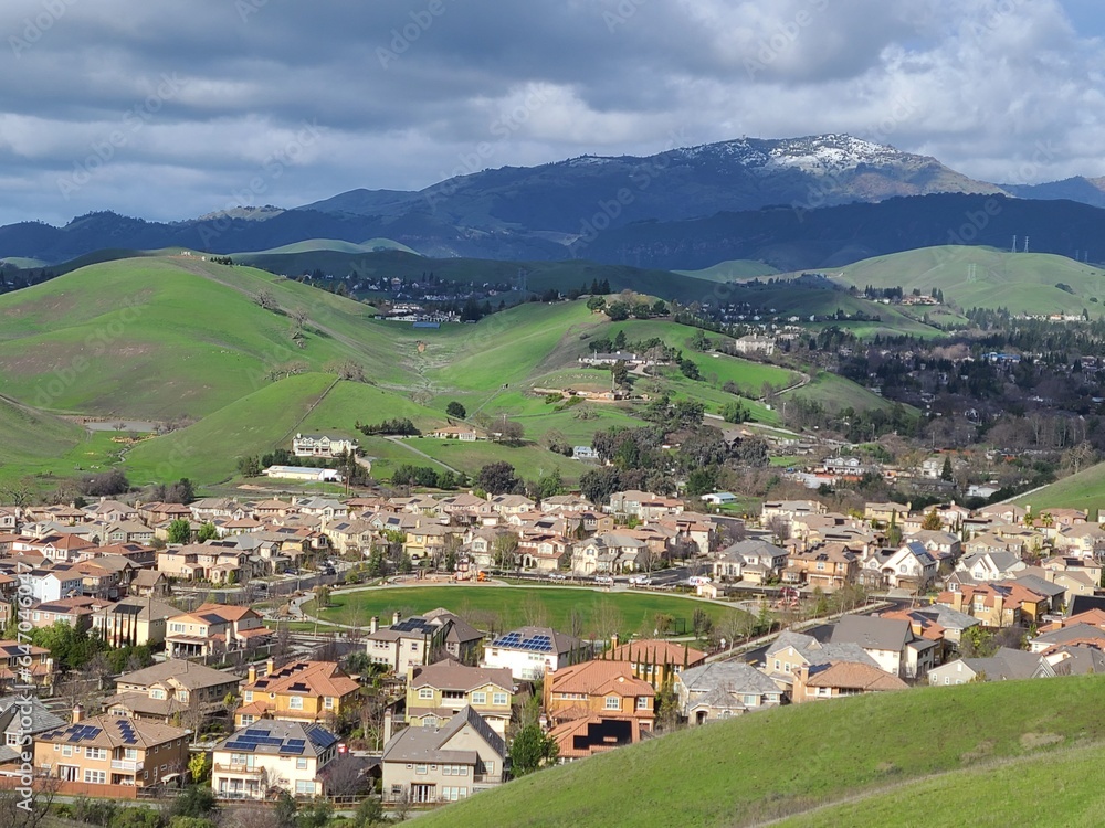 Homes in San Ramon between rolling hills of East Bay and snowy Mt Diablo after a winter storm Homes in San Ramon between rolling hills of East Bay and snowy Mt Diablo after a winter storm