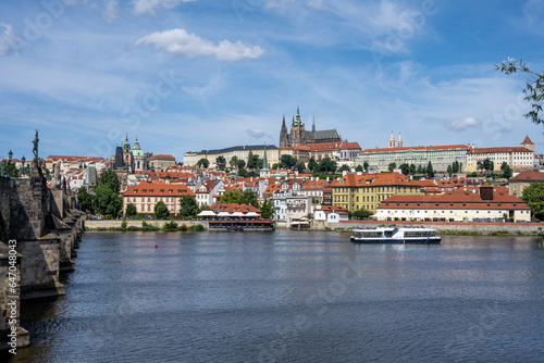 View to the Castle Hradcany in Prague on a sunny day with the famous Charles Bridge on the left