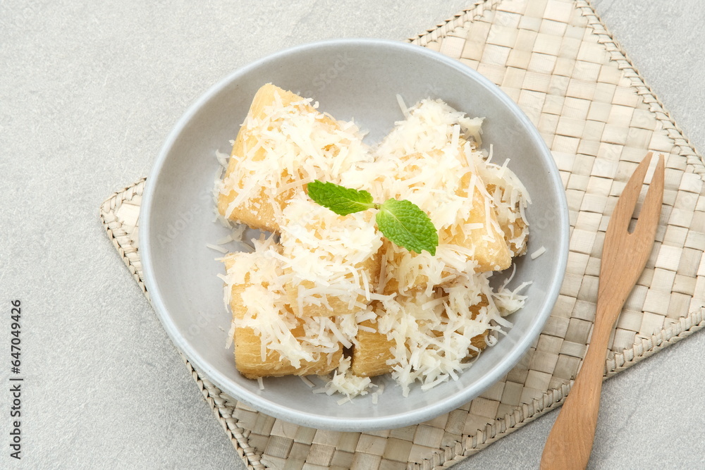 Fried cassava with cheese or singkong goreng keju, Indonesian traditional food.
Fried cassava with cheese or singkong goreng keju, Indonesian traditional food.