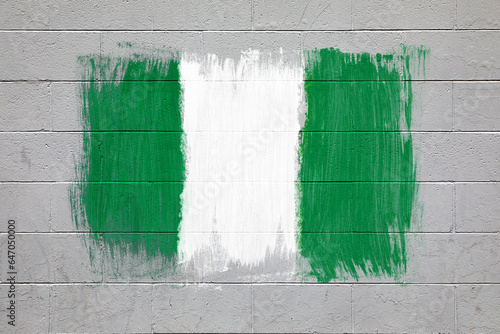 Nigerian flag colors painted on brick wall