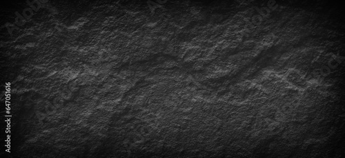 DDark gray black slate stone background or texture and gradients shadowand, horizontal shape with space for design.