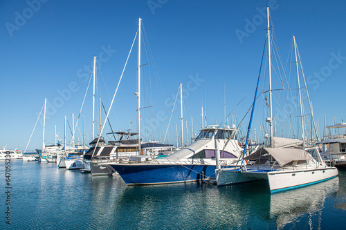 Yachts or boats on a sunny morning in a marina in La Paz Baja California Sur. Mexico. With clear blue summer sky
