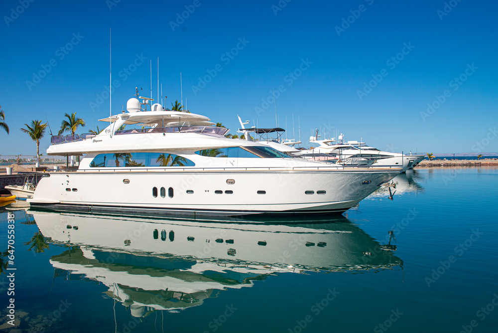 Yachts or boats on a sunny morning in a marina in La Paz Baja California Sur. Mexico. With clear blue summer sky - obrazy, fototapety, plakaty 