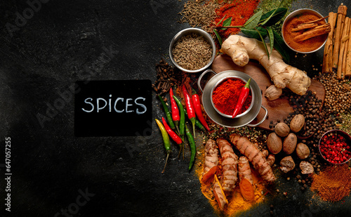 Spices on dark background. Different varius.