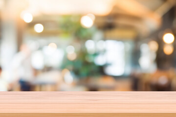 Wooden board empty table background. abstract blurred cafe background