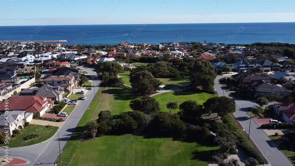 Slow Pull Back Shot Over Park With Ocean In Background, Perth Australia Slow Pull Back Shot Over Park With Ocean In Background, Perth Australia