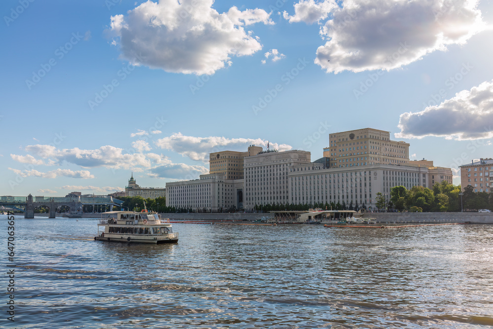 View of the Ministry of Defence of Russian Federation, and Moscow river embakment with cruise ships at sunset.