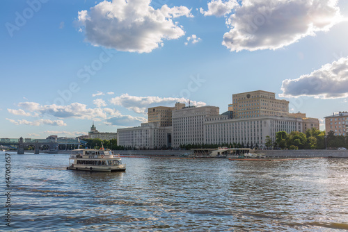 View of the Ministry of Defence of Russian Federation, and Moscow river embakment with cruise ships at sunset. © Dmitrii Potashkin