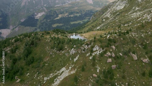 Small lake in the mountains of Switzerland. Lake Mässersee in Binntal. Beautiful mountain panorama photo