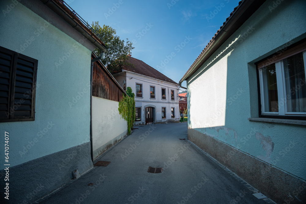 Old and narrow streets in the old part of Lasko, small city in lower slovenian styria famous for its thermal baths and beer brewing. summer in small streets of lasko.