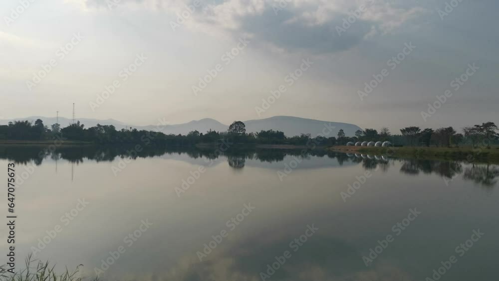 A Pristine, Still Lake Showcases Crystal Clarity and Reflects the Beauty of Its Surrounding Landscape in Thailand. A Pristine, Still Lake Showcases Crystal Clarity and Reflects the Beauty of Its Surrounding Landscape in Thailand.