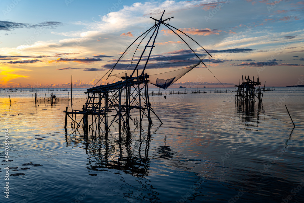 Beautiful Silhouette the square dip net in the Morning at Pak Pra, Phatthalung, Thailand Beautiful Silhouette the square dip net in the Morning at Pak Pra, Phatthalung, Thailand