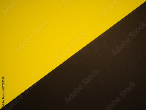 Yellow and black backdrop paper background. Top view