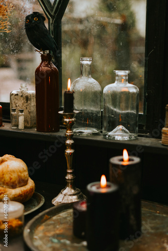 Halloween party decor in gloomy dark colors with the table is set