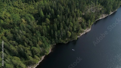 50fps aerial footage couple Kayaking Boat tour on lake Ragnerudssjoen in Dalsland Sweden beutiful nature forest pinetree photo