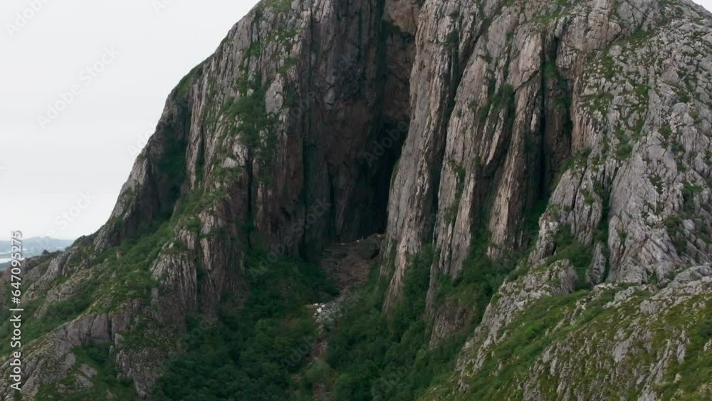 Drone reveal mystical Torghatten from dark hole through mountain Drone reveal mystical Torghatten from dark hole through mountain