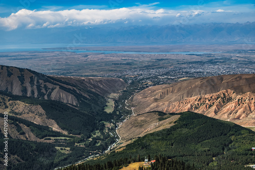 View of the city of Karakol and Lake Issyk Kul in Kyrgyzstan.