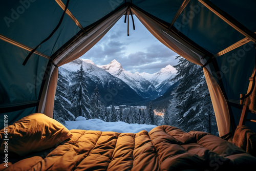 POV from a camping tent: scenic view of the snowy mountains in the winter.