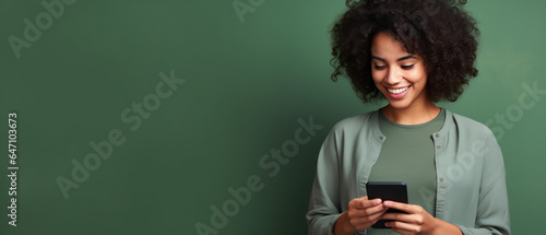 woman with mobile phone over Green background