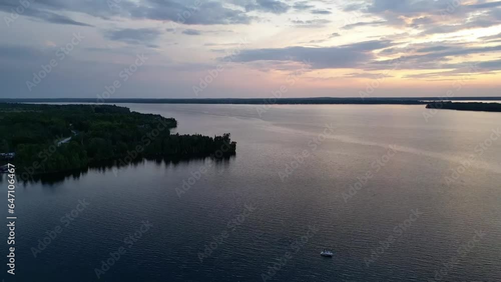 Reflections Over Idyll Seascape During Sunset In Lake Rosseau, Ontario, Canada. Aerial Drone Shot