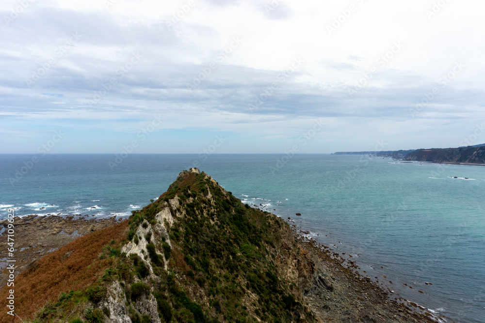 View from the La Regalina viewpoint. In the foreground you can see the Tip of the Horn and in the background the sea and the coast. Cadavedo, Asturias.